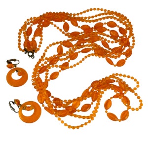 Cool vintage tangerine plastic bead necklace and hoop earring set. Hong Kong