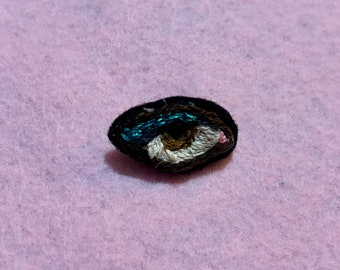 Brown and Metallic Blue Embroidered Eye Brooch