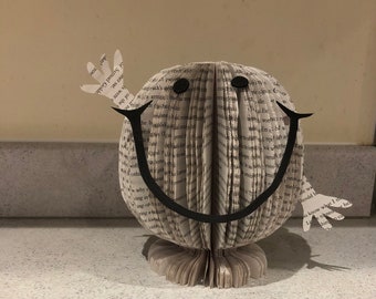 Fun Happy character made from a recycled book