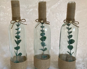 10 x Rustic Eucalyptus filled wine bottles, decorated in a rustic and green  theme perfect for wedding centrepiece's