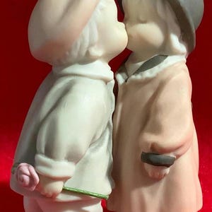 Pretty as a Picture ornament &quot;Love Sealed with a Kiss&quot; 284580 Kim Anderson, featuring couple kissing with boy carrying rose, new with box
