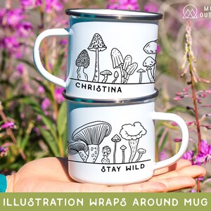 May include: White enamel mug with a black and white illustration of mushrooms and the text "Christina" and "Stay Wild".