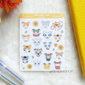 Op de afbeelding: Een stickervel met verschillende cartoon hamster karaktertjes met verschillende accessoires en uitdrukkingen. Het vel bevat zonnebloemen en de tekst "HAM-HAM CLUB" en "@KEHENASHOP". De stickers staan op een witte achtergrond.