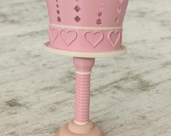 PIoiuse Style Rotating Crown For LipGloss and other makeup.