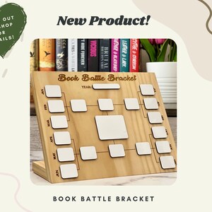 May include: A wooden "Book Battle Bracket" with a tournament layout. It features spaces for book titles and a "YEAR" section. The image also includes the text "New Product!" and "CHECK OUT THE SHOP FOR DETAILS!"