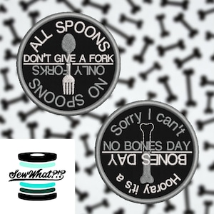 May include: Two black and white embroidered iron-on patches. The first patch is round and says "All Spoons Don't Give A Fork Only Forks No Spoons". The second patch is round and says "Sorry I Can't No Bones Day Hooray It's a Bones Day".