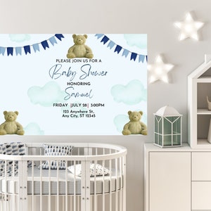 May include: Baby shower invitation with a light blue background, featuring teddy bears, clouds, and blue bunting. The invitation text reads "Please join us for a Baby Shower honoring Samuel" with date, time, and address details.