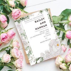 May include: A wedding invitation with the names "Bailey and Hannah" is displayed, surrounded by pink roses and greenery. The invitation includes the date, address, and recipient's name. The design features floral accents.