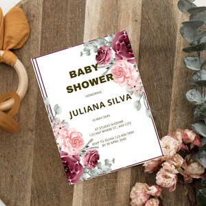 May include: A baby shower invitation with floral accents. The invitation features the text "BABY SHOWER HONORING JULIANA SILVA" with event details. The design includes burgundy and pink flowers and greenery, set against a white background.