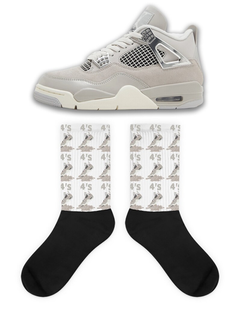 May include: A pair of gray and white sneakers with a silver accent and a pair of white socks with a gray print of the sneakers. The socks have the text "4'S" repeated on them.