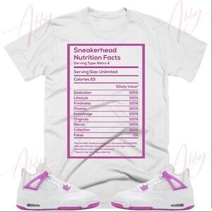 May include: White t-shirt with a pink graphic of a nutrition facts label for sneakerheads. The label lists categories like dedication, lifestyle, freshness, passion, knowledge, originals, retros, collection, and fakes. The label states "Serving Type: Retro 4" and "Serving Size: Unlimited".