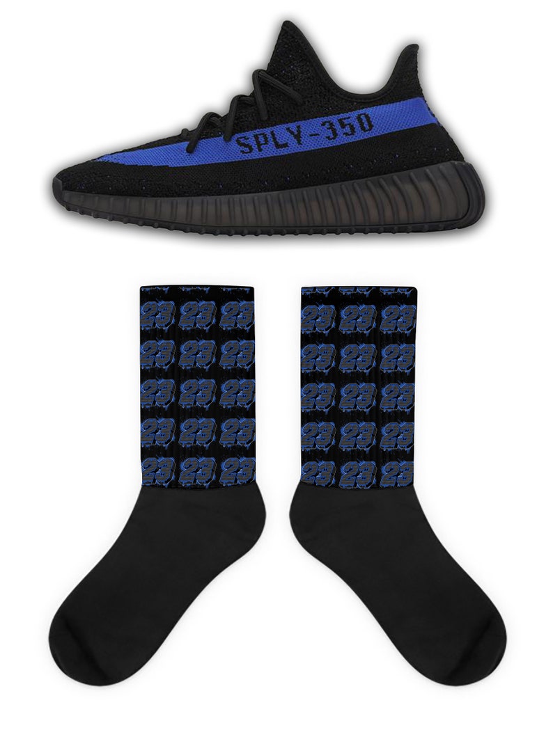 May include: Black and blue sneakers with the text "SPLY-350" on the side. A pair of black socks with a blue number 23 pattern.