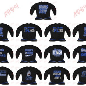 May include: A set of 10 black long-sleeved shirts with blue and silver glitter designs. The designs include "Young Drip", "My Mommy is the Plug", "My Daddy is the Plug", "Mr. Big Bag", "Fresh Like My Daddy", "Money 2 Burn", "Money Talks", "Gucci Gang", "Sneaker Princess", "Can't Cheat the Grind", and "23".