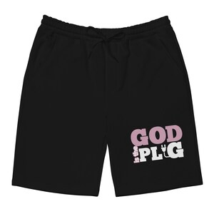 May include: Black sweatpants with a pink and white graphic that says "God is the Plug" with a plug symbol.