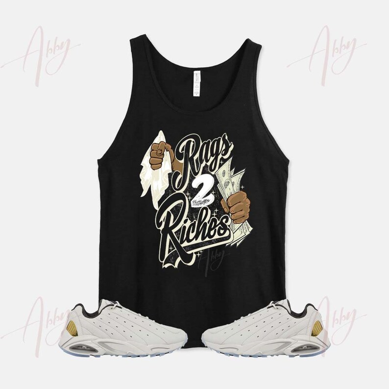 May include: A black tank top with a graphic print of a hand tearing through a white cloth revealing a stack of money with the text "Rags 2 Riches". The tank top is paired with a pair of white sneakers with black accents.