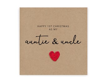 May include: A brown card with the text "Happy 1st Christmas as my auntie & uncle" and a red heart.