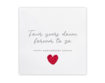 May include: A white card with the text "Four years down forever to go" and "Happy Anniversary Sophie". A small red heart is in the bottom center of the card.