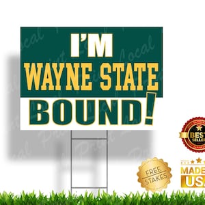 May include: A green and gold yard sign with the text "I'M WAYNE STATE BOUND!"  The sign is on a white background and has a green border. The sign is on a metal stake.