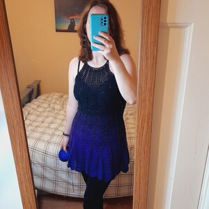 May include: A blue and black ombre crochet dress with a scalloped hemline.