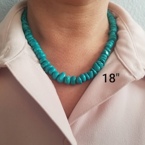 May include: Turquoise beaded necklace, 18 inches long.