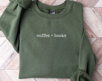 May include: A dark green sweatshirt with the text "coffee + books" in white lettering.
