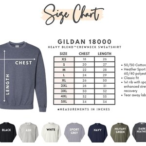 May include: A size chart for a Gildan 18000 heavy blend crewneck sweatshirt, with chest and length measurements in inches. The chart includes sizes XS to 5XL. The sweatshirt is shown in a blue-gray color. Below are color options: sand, black, ash, white, sport grey, navy, military green, dark heather, and light pink.