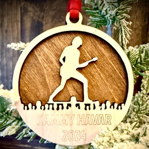 Rock concert rockstar guitar player 2-layer personalized laser cut wood Christmas ornament, gift tag available in 12 finishes.