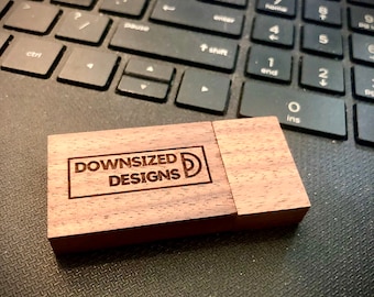 May include: A wooden USB drive with the text "DOWNSIZED DESIGNS D" engraved on the top.