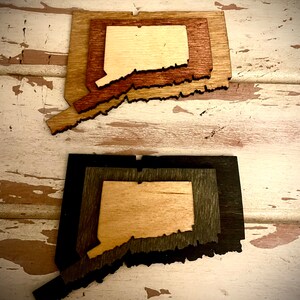 Connecticut 3-layer stacked state laser cut wood magnet available in brown tones or gray tones.