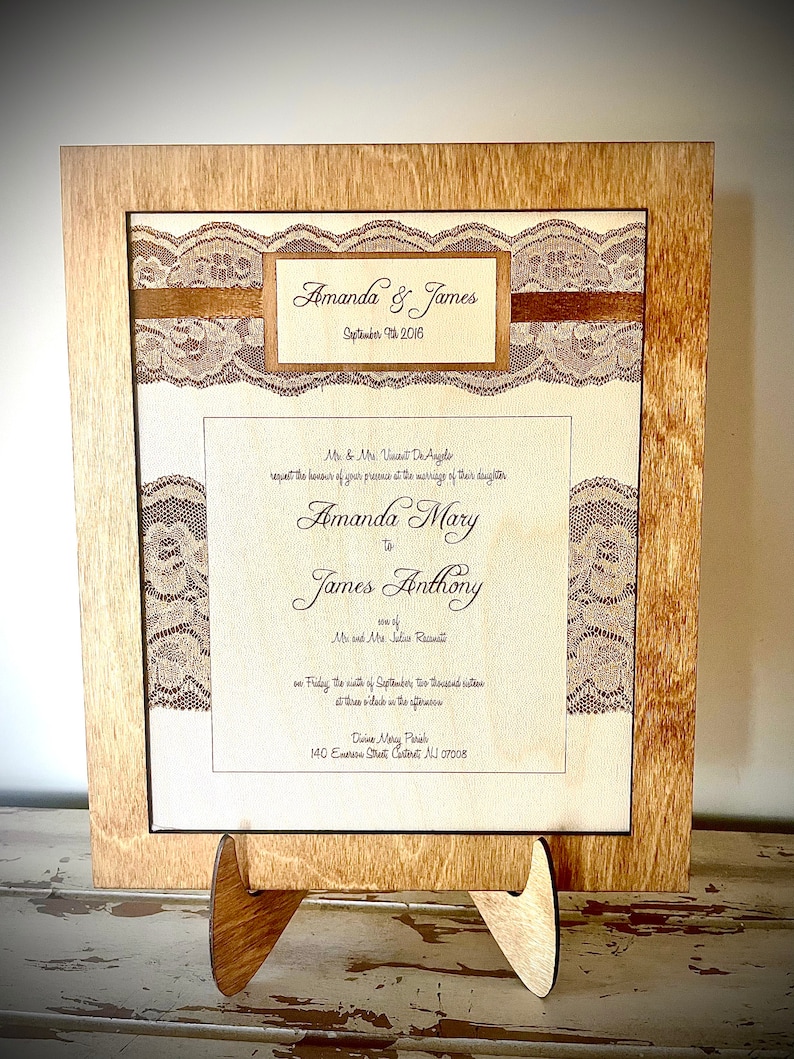 May include: A wedding invitation with a lace design and a brown ribbon. The invitation is for Amanda and James, and it states the date as September 2nd, 2016. The invitation also includes the names of the bride's parents, the groom's parents, the wedding location, and the time of the ceremony.