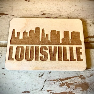 Magnet - Louisville Skyline cityscape. 3.5&quot; X 2.5&quot; wood magnet.  Great souvenir or memento from your favorite city.