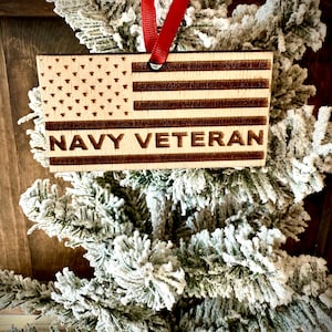 Navy Veteran laser engraved US flag ornament.  1/4 inch wood.  4 inches X 2.1 inches.  Great gift to show pride!