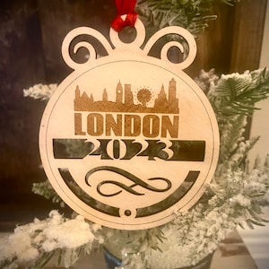 Ornament - London Skyline cityscape. 4&quot; X 4.75&quot; wood ornament with choice of year.  Great souvenir or memento from your favorite city