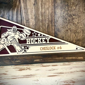 Personalized Custom Female Hockey Goalie Wood 2-layer pennant with player name and number engraved-available in 12 finishes.