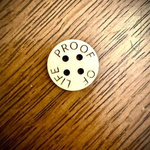 Custom wood buttons with laser engraved text available in assorted quantities