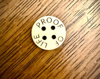 Custom wood buttons with laser engraved text available in assorted quantities