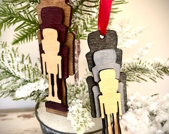 Stacked nutcracker wood ornament or gift tag available in brown or grey tones
