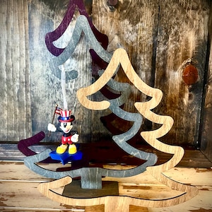 Christmas tree shaped ornament hanger available in 3 sizes and 12 finishes.
