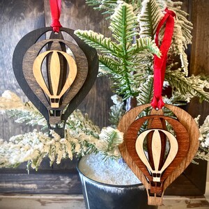 Stacked hot air balloon laser cut wood ornament, hot air balloon gift tag, available in brown or gray tones.
