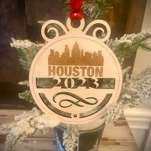 Ornament - Houston Skyline cityscape. 4&quot; X 4.75&quot; wood ornament with choice of year.  Great souvenir or memento from your favorite city