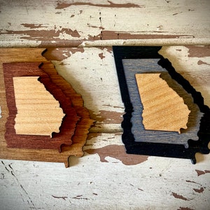 Georgia 3-layer stacked state laser cut wood magnet available in brown tones or gray tones.