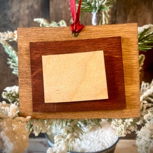 Wyoming 3-layer stacked state ornament laser cut wood ornament, Wyoming gift tag available in brown tones or gray tones.