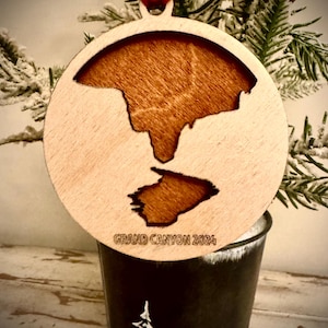 Grand Canyon scene with water and rock formations 2-layer personalized laser cut wood Christmas ornament, gift tag available in 12 finishes.