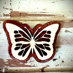 Butterfly 2 layer wood refrigerator magnet in choice of 12 finishes.
