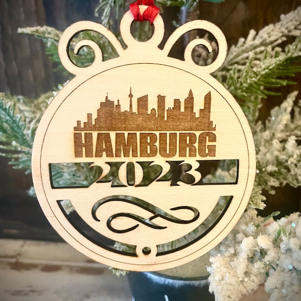 Ornament - Hamburg Skyline cityscape. 4" X 4.75" wood ornament with choice of year.  Great souvenir or memento from your favorite city