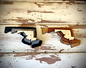 Maryland 3-layer stacked state laser cut wood magnet available in brown tones or gray tones.