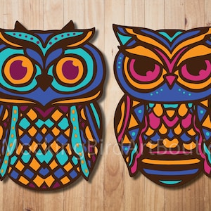 May include: Two colorful owl illustrations with intricate geometric patterns in shades of blue, orange, teal, pink, and brown. The owls have large eyes and are facing forward.