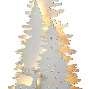 May include: White wooden Christmas tree silhouette with a deer and stars cut out. The tree is illuminated with warm white LED lights.