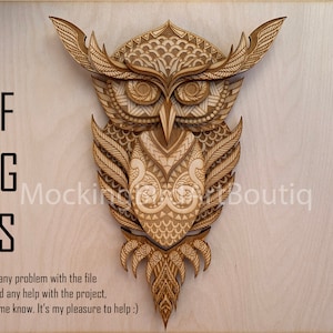 May include: A detailed, intricate owl design cut from wood. The owl is in a mandala style with geometric patterns. The image includes the text "Ai, DXF, SVG, EPS".