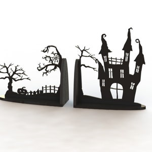 May include: A pair of black wooden bookends shaped like a spooky Halloween scene. One bookend features a haunted house with a pointed roof and windows. The other bookend features a spooky tree with a spider web and a pumpkin.